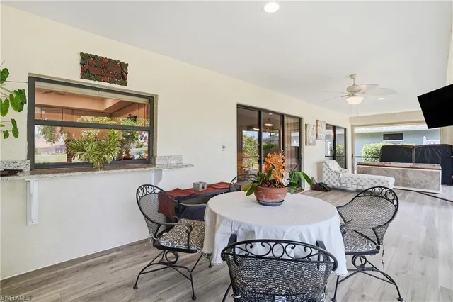 a view of a dining room with furniture window and outside view
