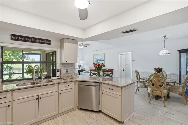 a kitchen with sink and cabinets