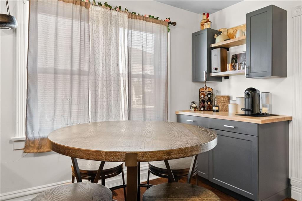 1906 Cliff Street Coraopolis, PA 15108 - Photo 16 of 39 a kitchen with stainless steel appliances a table and chairs in it