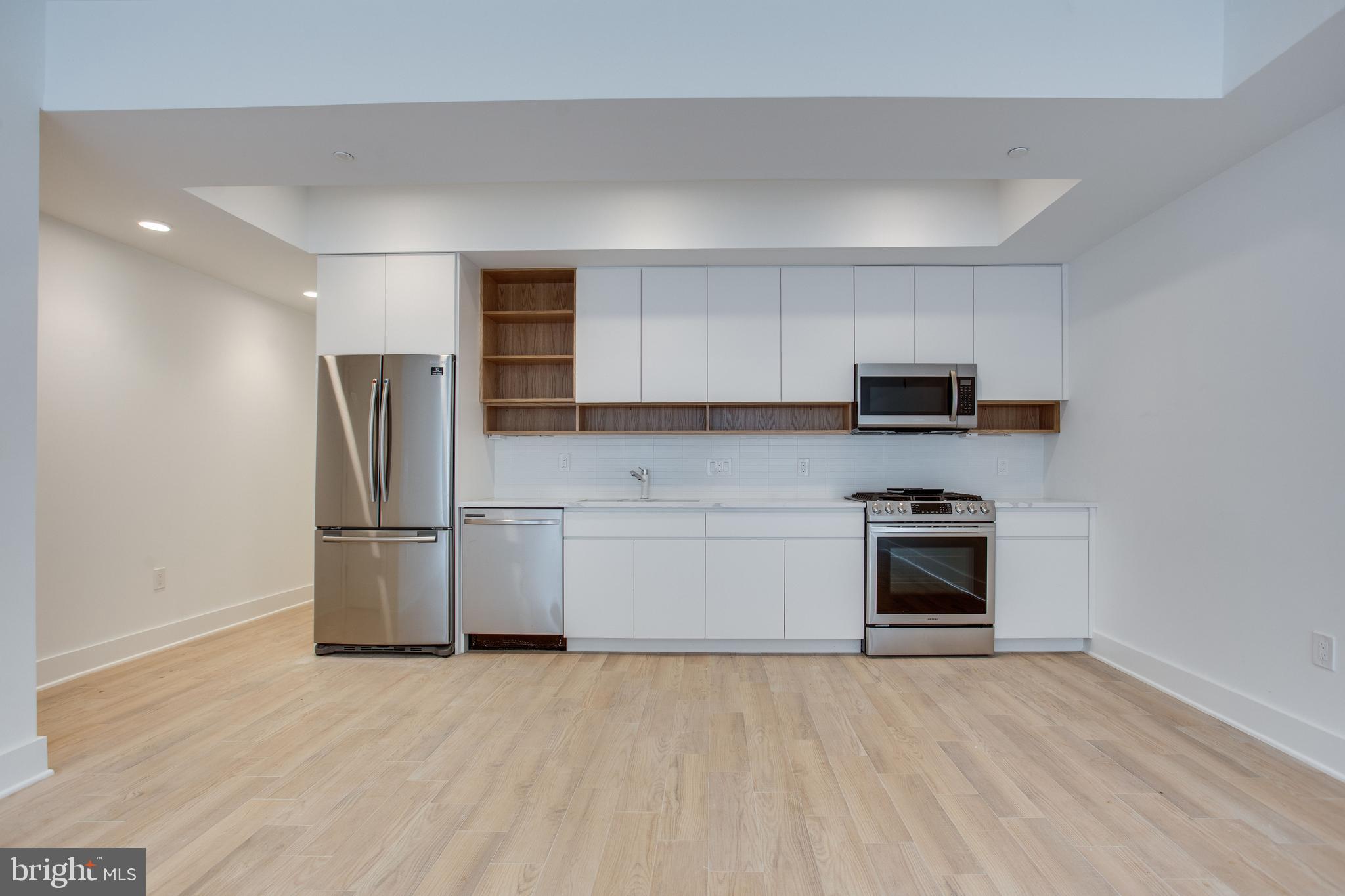 3541 11th Street Northwest, Unit 3 Washington, DC 20010 - Photo 1 of 12 Stainless steel, gas range, and ample cabinetry.