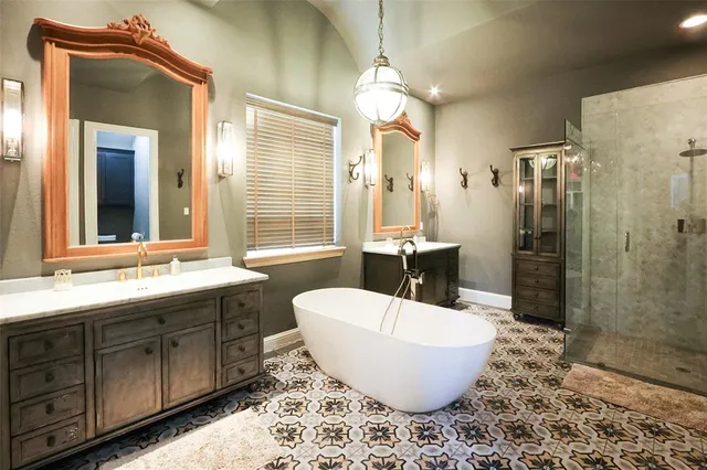 a view of staircase with railing and a chandelier