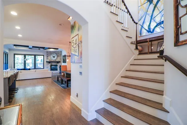 a view of entryway and hall with wooden floor