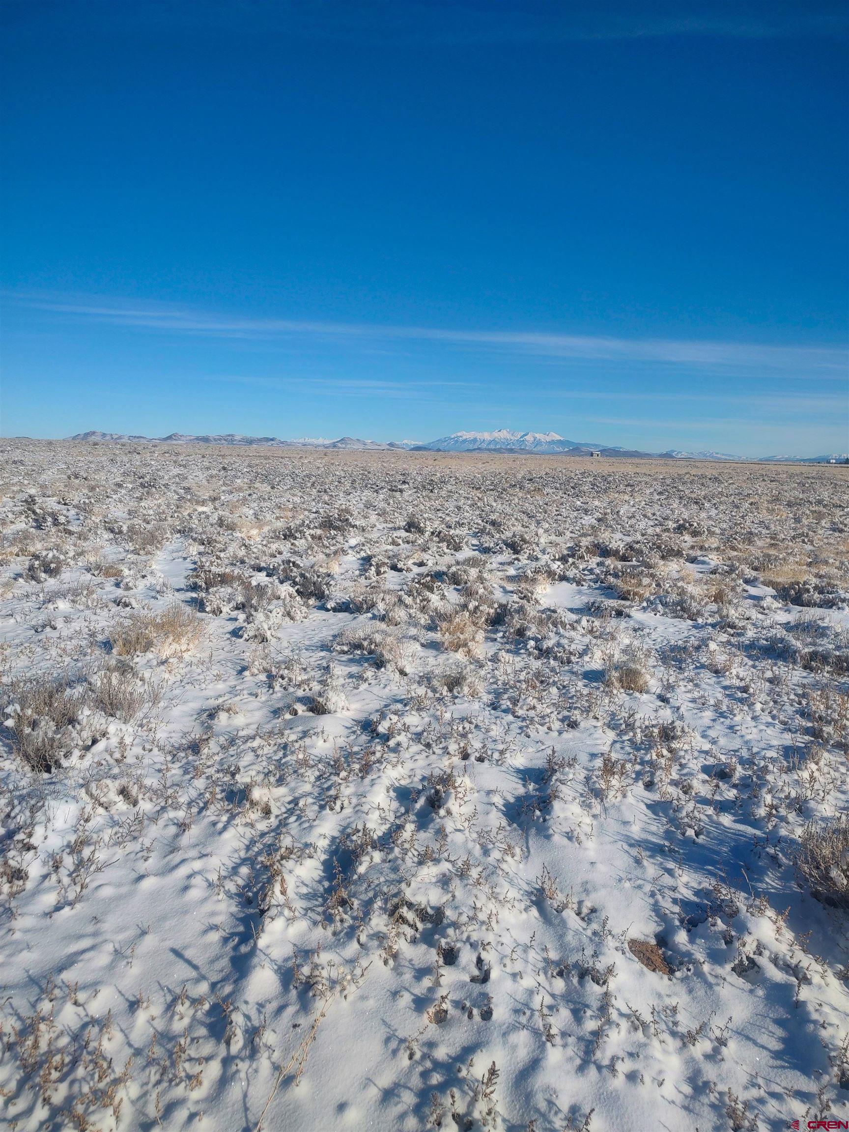 3935 County Rd G San Luis, CO 81152 - Photo 2 of 9 a view of a big yard with a city view