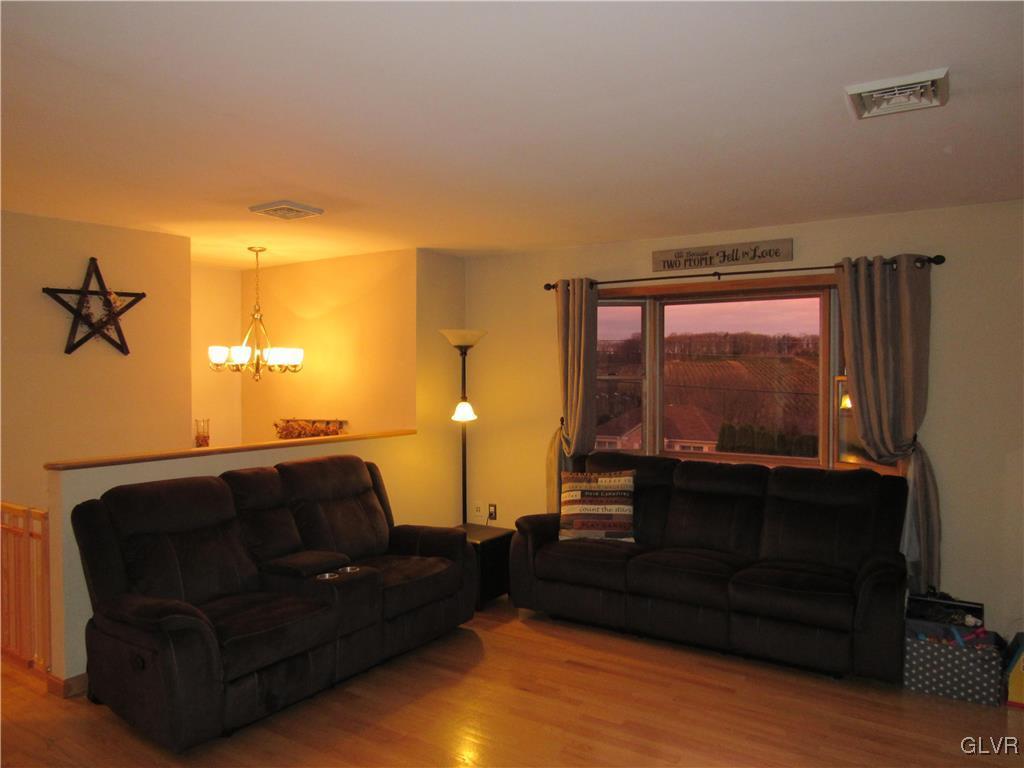 555 Bauer Road Bath, PA 18014 - Photo 5 of 36 a living room with furniture and a flat screen tv