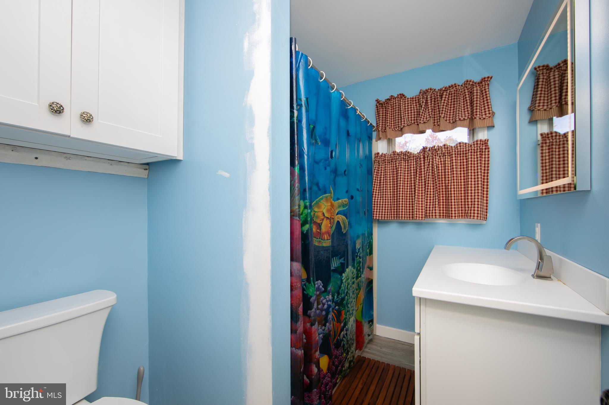 38 Lincoln Avenue Clementon, NJ 08021 - Photo 14 of 38 a bathroom with a sink and a mirror