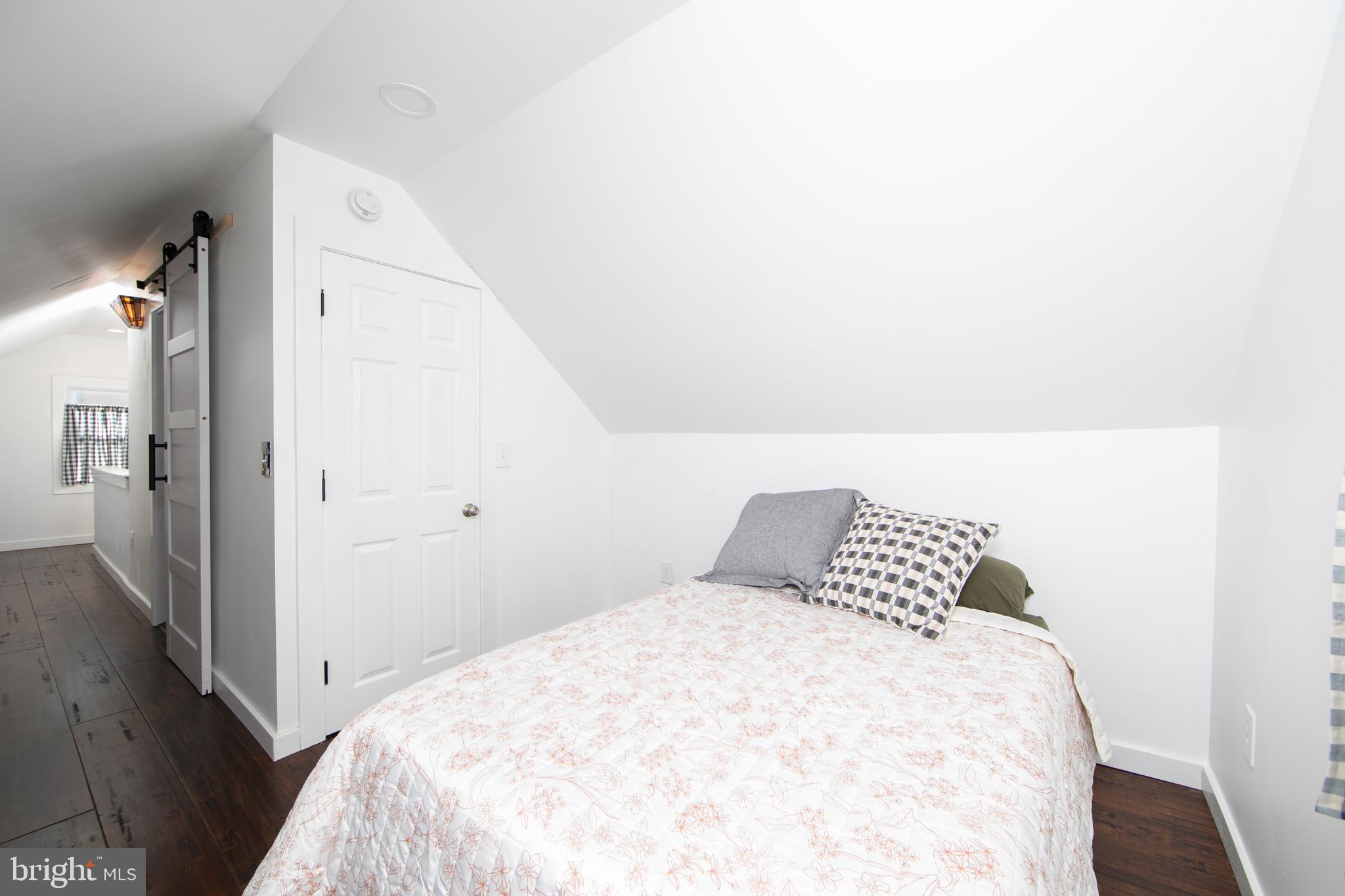 38 Lincoln Avenue Clementon, NJ 08021 - Photo 17 of 38 a bedroom with a white bed and wooden floor