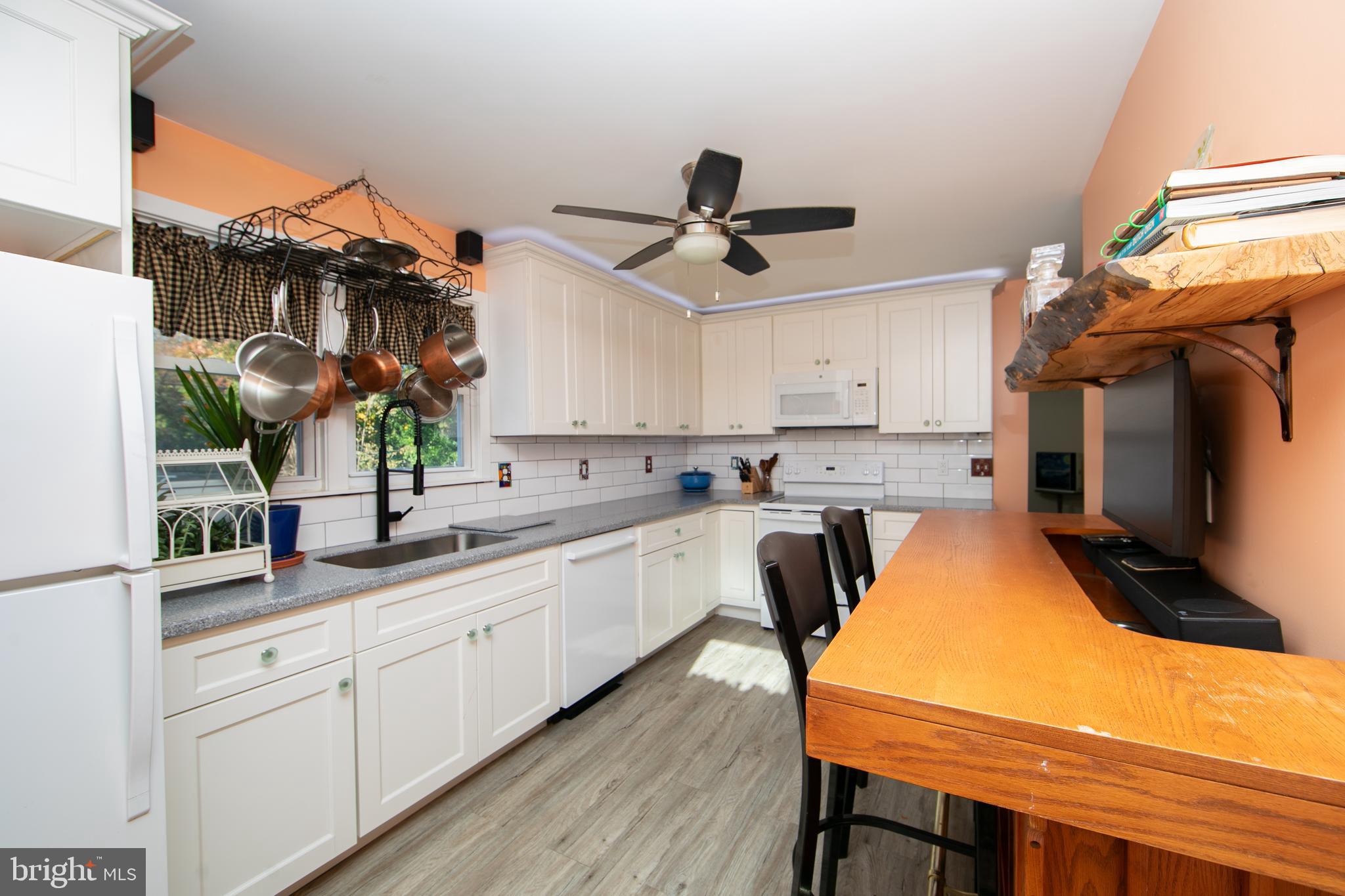 38 Lincoln Avenue Clementon, NJ 08021 - Photo 23 of 38 a kitchen with stainless steel appliances granite countertop a sink and cabinets