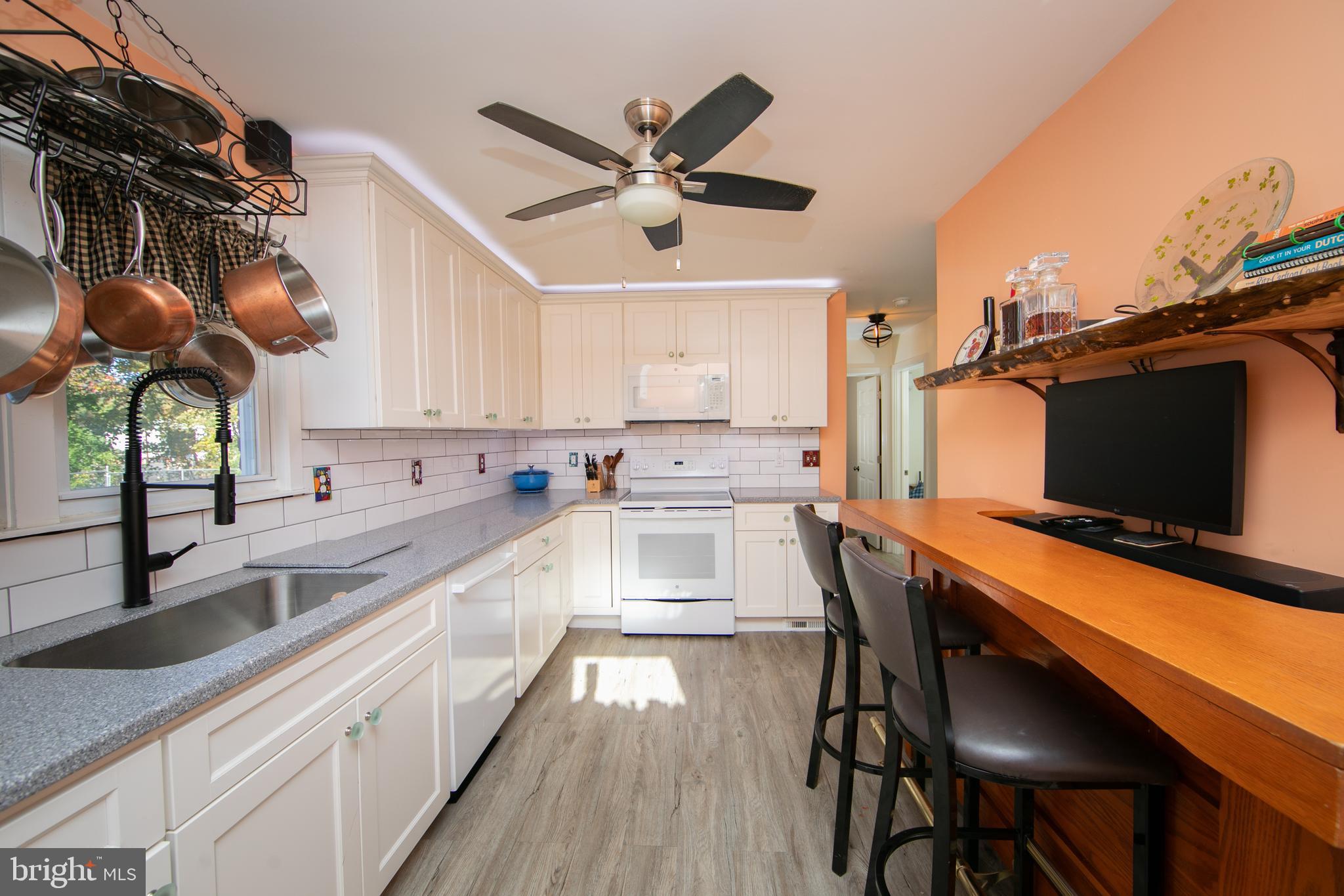 38 Lincoln Avenue Clementon, NJ 08021 - Photo 6 of 38 a kitchen with stainless steel appliances a stove a sink and a microwave
