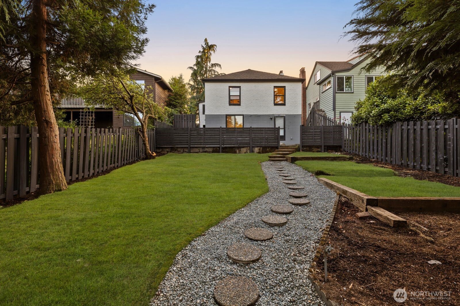 8216 Interlake Avenue North Seattle, WA 98103 - Photo 24 of 36 a view of a house with a yard