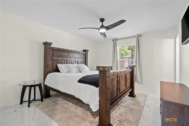 a bed room with a bed and a night stand