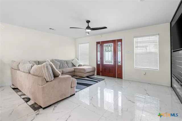 a living room with furniture and a window
