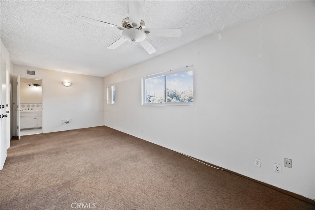 101 Hampden Terrace Alhambra, CA 91801 - Photo 32 of 46 an empty room with a empty space and a ceiling fan