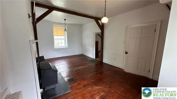 a view of entryway with wooden floor