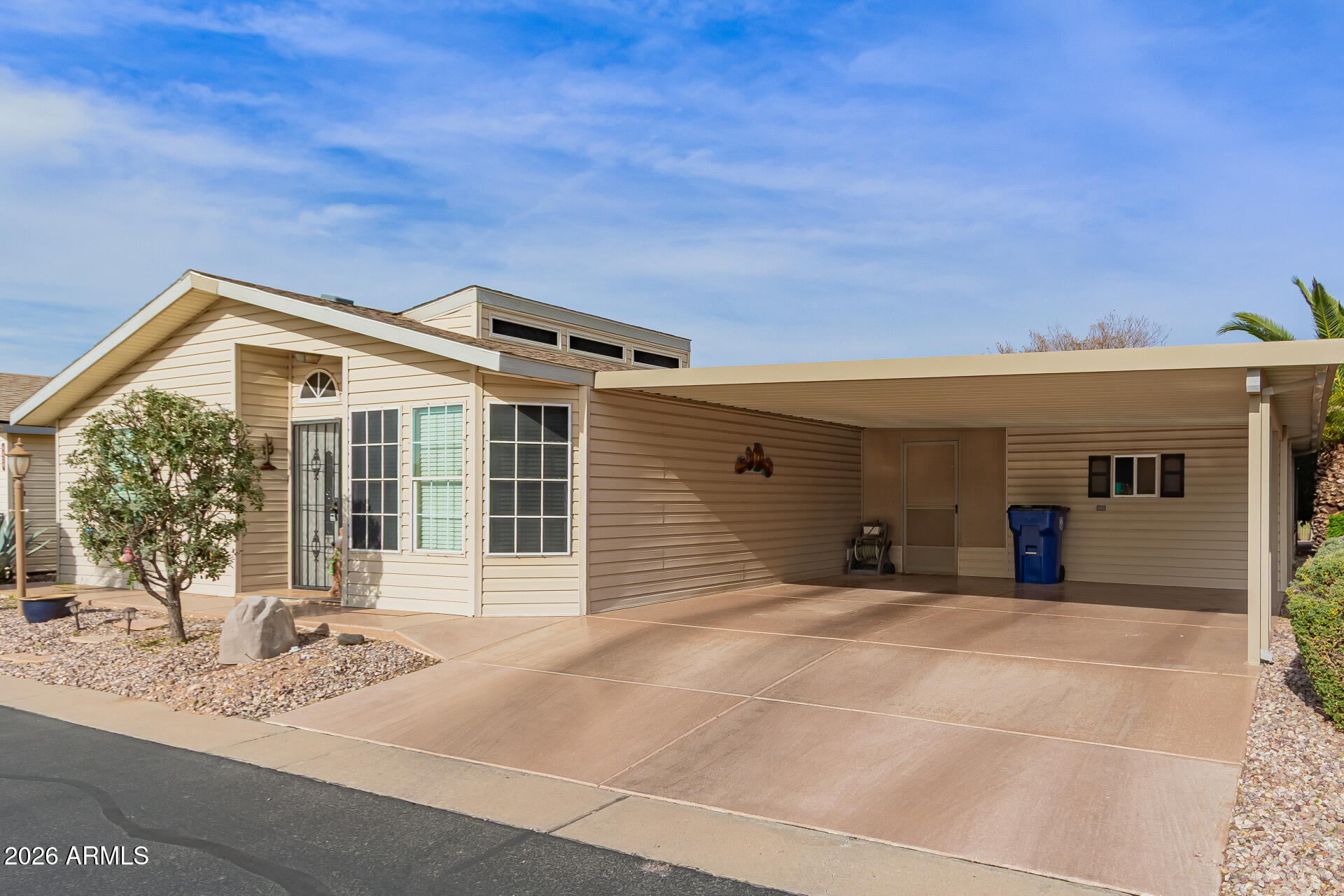 3301 South Goldfield Road, Unit 4028 Apache Junction, AZ 85119 - Photo 16 of 43 a view of a house with a patio