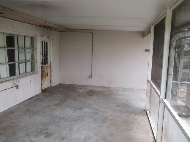 2107 Hunter Road Okeechobee, FL 34974 - Photo 22 of 28 Covered screened patio 2d view
