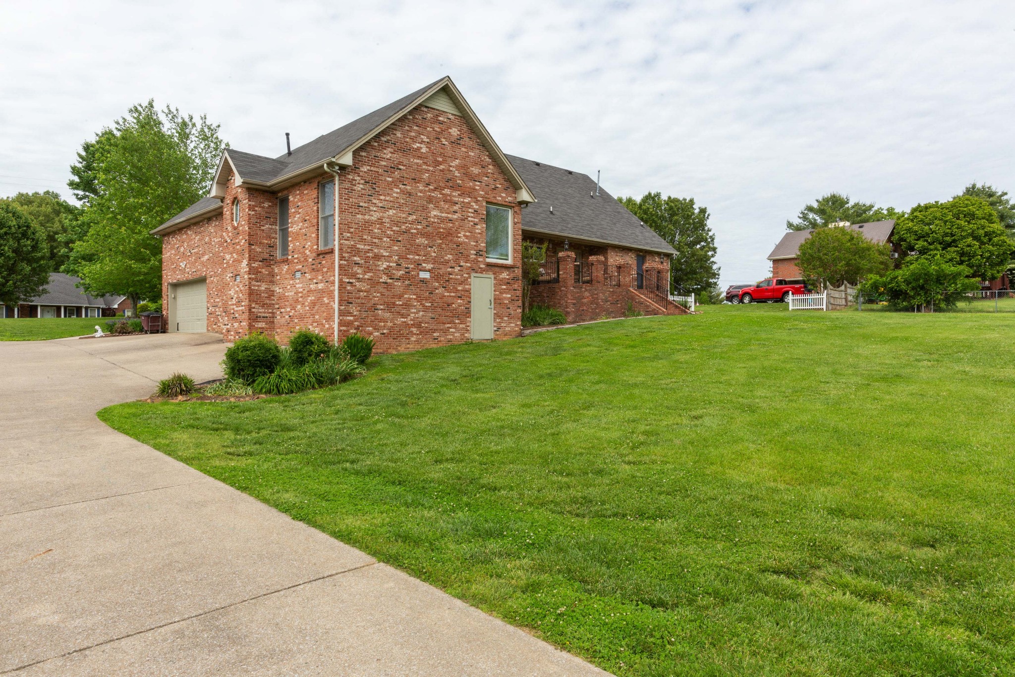 5059 Highpoint Road Pleasant View, TN 37146 - Photo 11 of 41 a front view of brick house with a yard