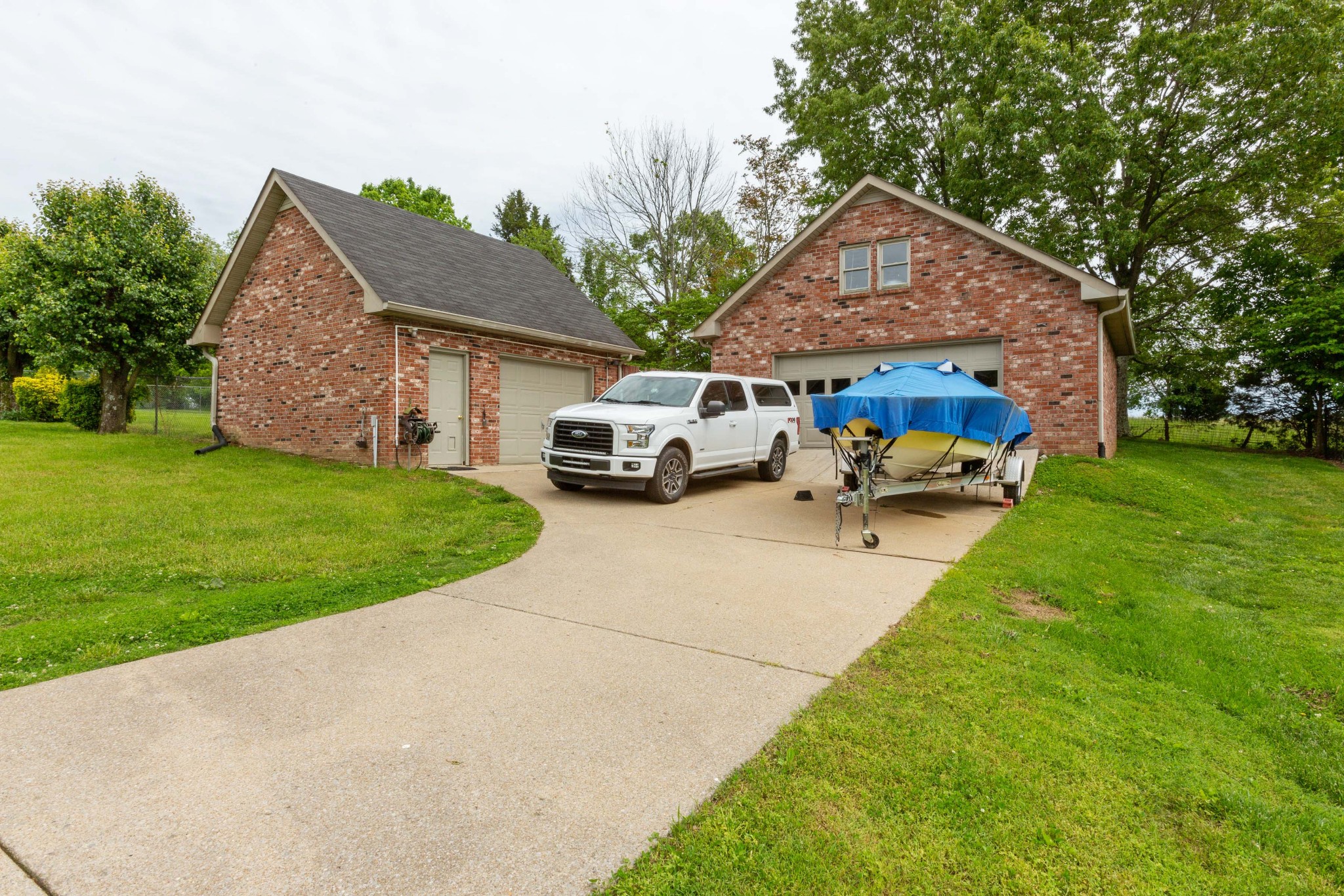 5059 Highpoint Road Pleasant View, TN 37146 - Photo 14 of 41 a car parked in front of house with a yard