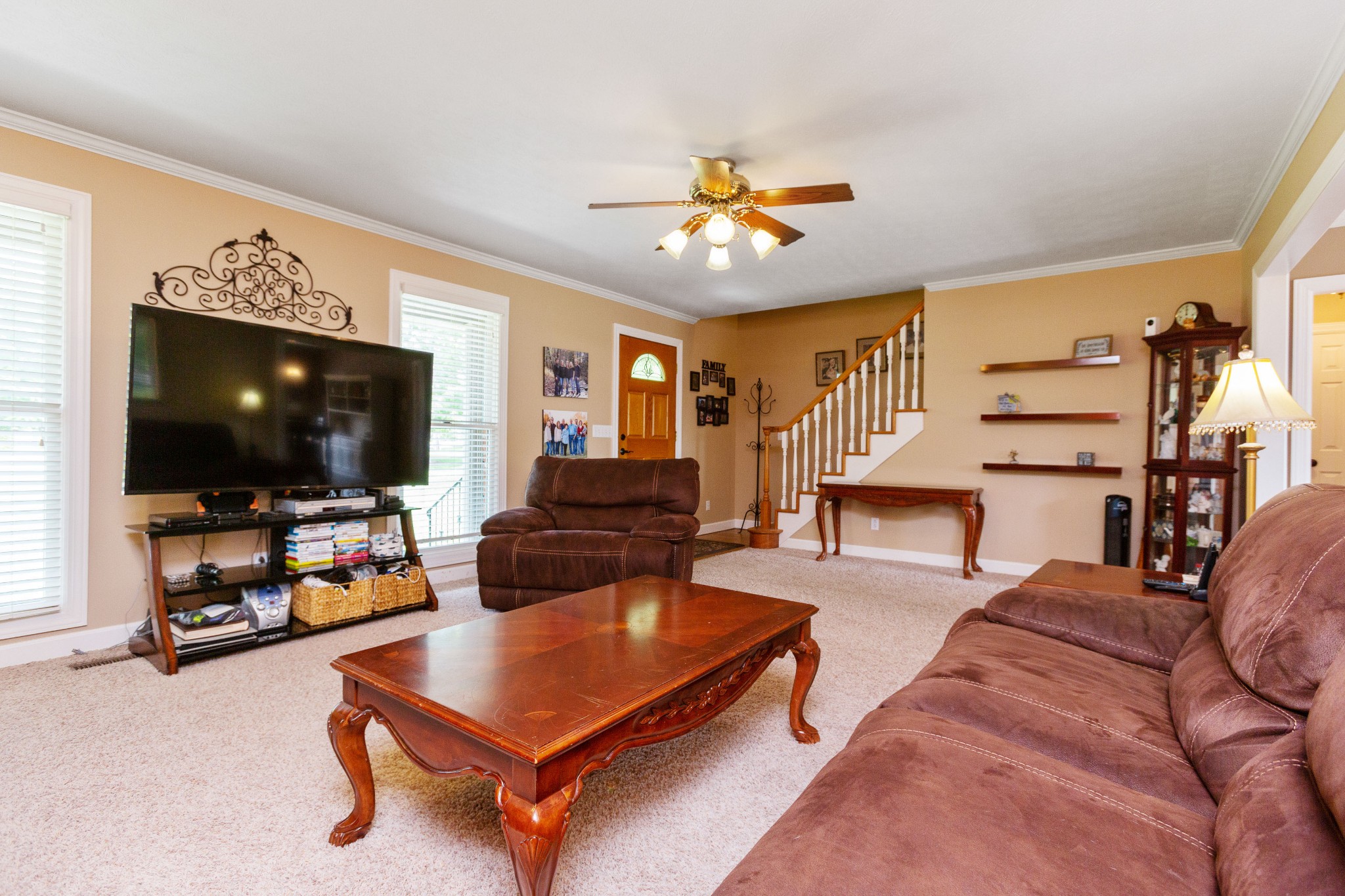 5059 Highpoint Road Pleasant View, TN 37146 - Photo 15 of 41 a living room with furniture and a flat screen tv