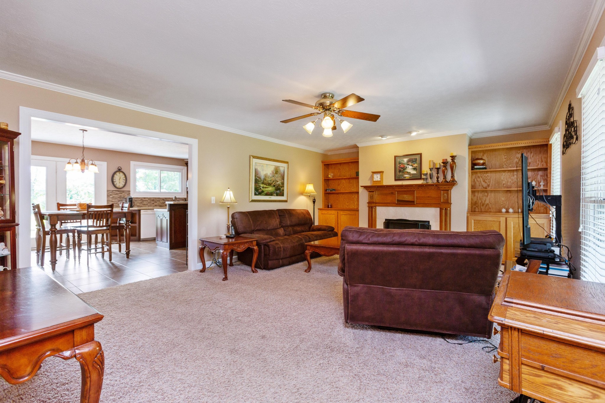 5059 Highpoint Road Pleasant View, TN 37146 - Photo 17 of 41 a living room with furniture a fireplace and a flat screen tv