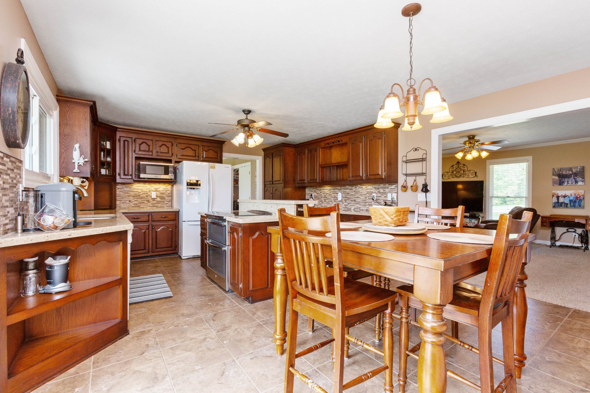 5059 Highpoint Road Pleasant View, TN 37146 - Photo 19 of 41 a view of a dining room and livingroom with furniture wooden floor a chandelier