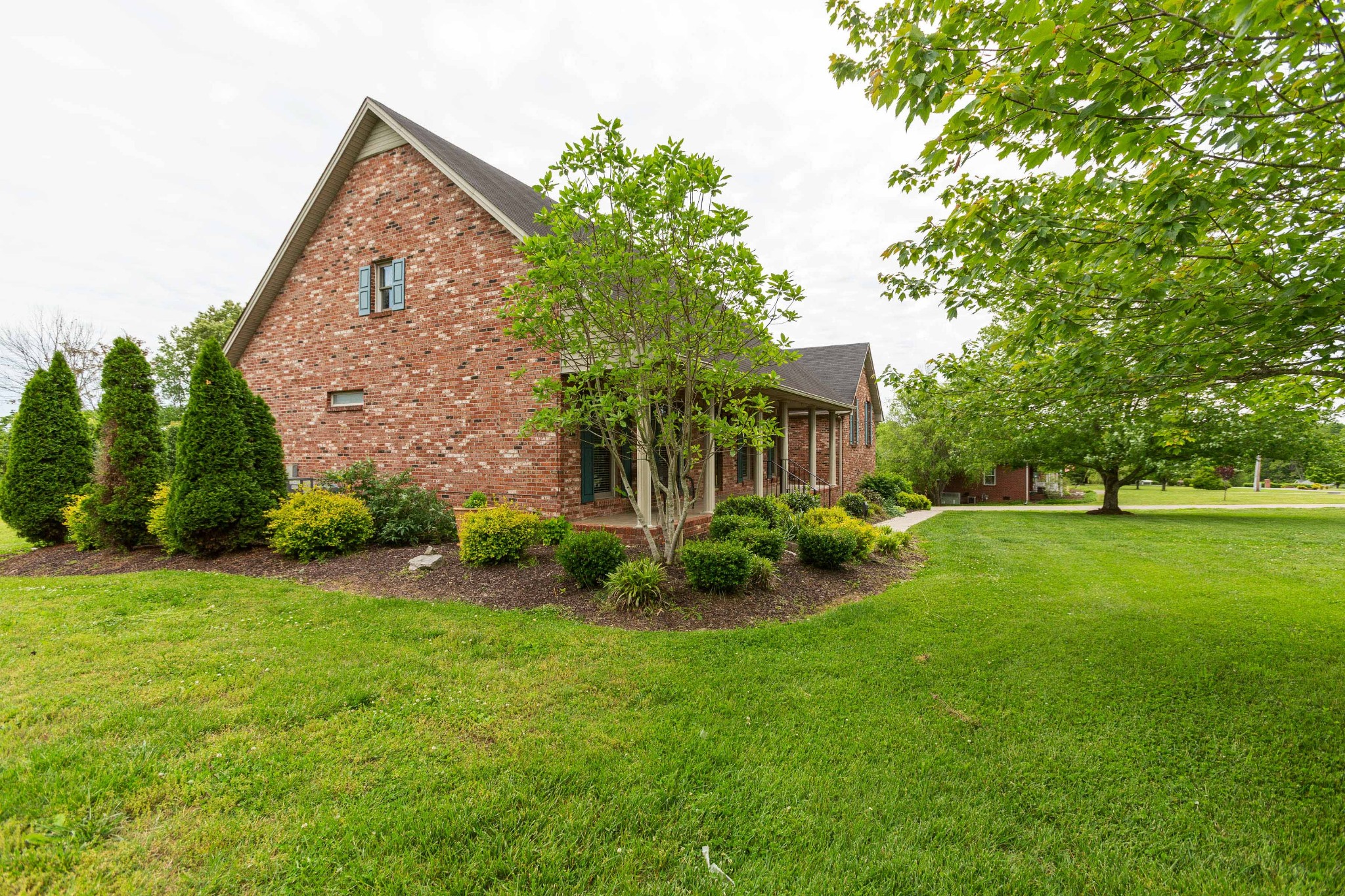 5059 Highpoint Road Pleasant View, TN 37146 - Photo 3 of 41 a view of a house with backyard and garden