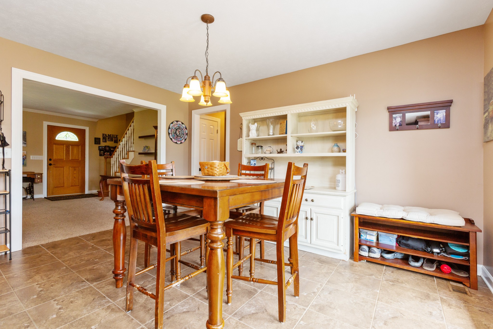 5059 Highpoint Road Pleasant View, TN 37146 - Photo 21 of 41 a view of a dining room with furniture and a chandelier