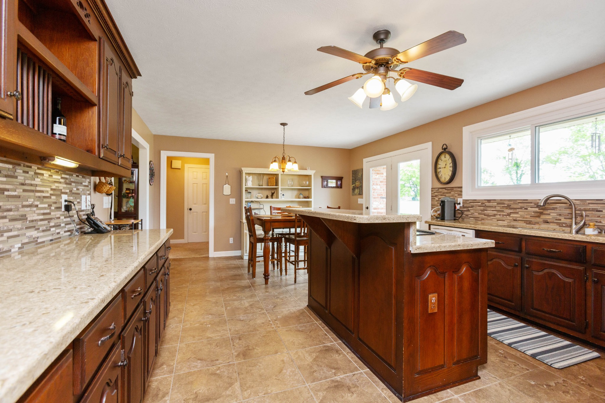 5059 Highpoint Road Pleasant View, TN 37146 - Photo 23 of 41 a kitchen with center island table and chairs