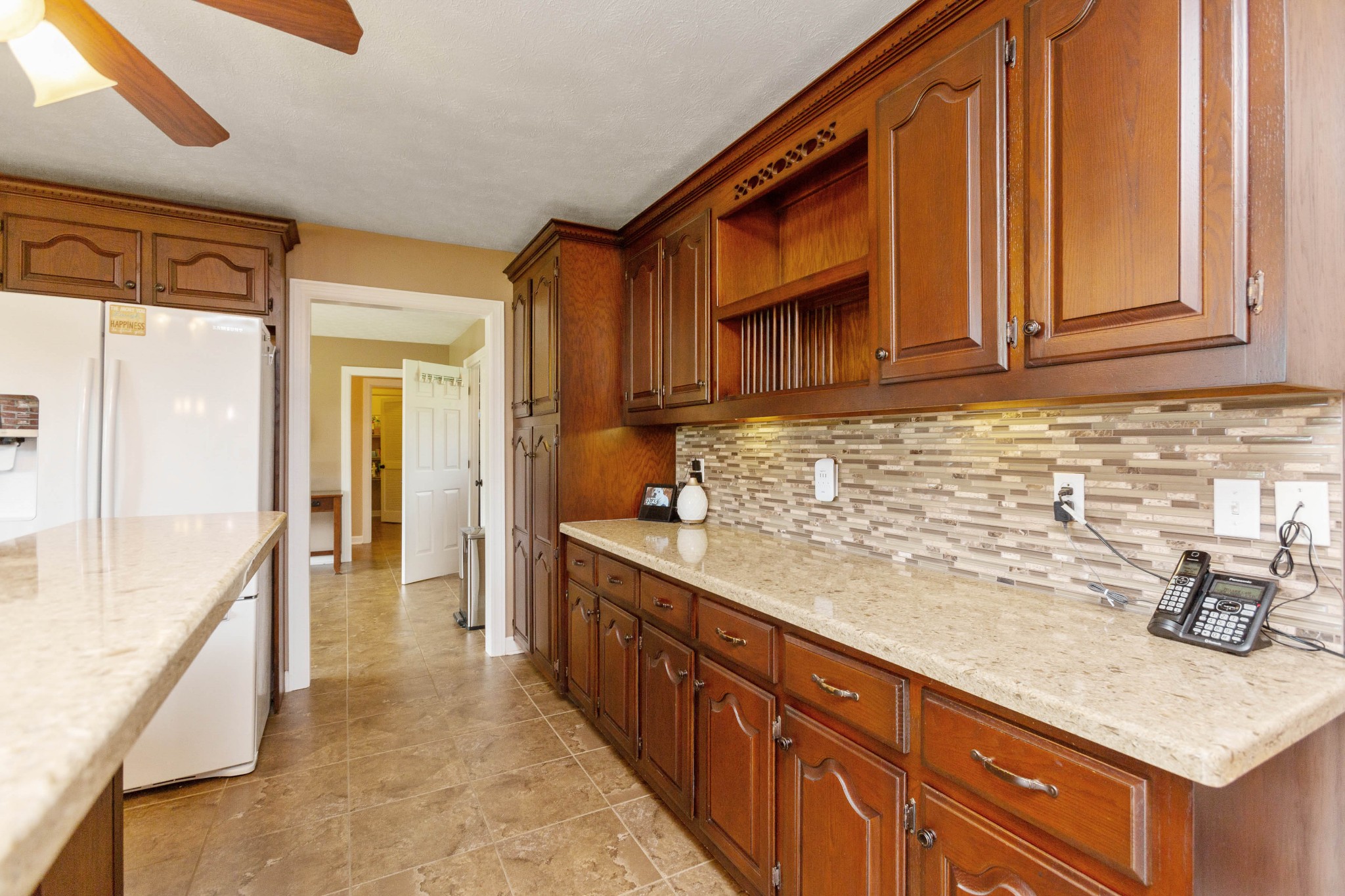 5059 Highpoint Road Pleasant View, TN 37146 - Photo 25 of 41 a kitchen with stainless steel appliances granite countertop wooden cabinets a sink and dishwasher