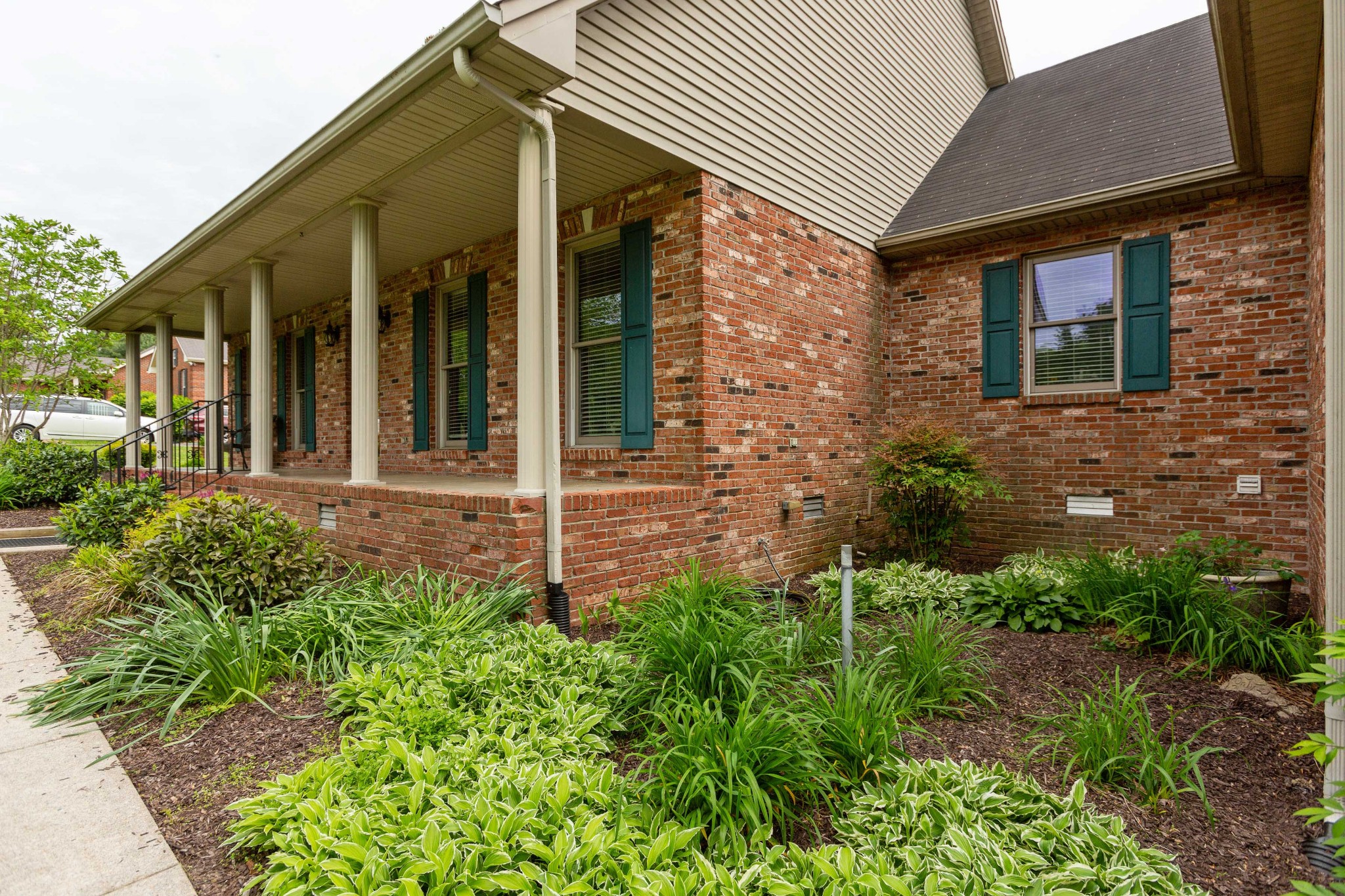 5059 Highpoint Road Pleasant View, TN 37146 - Photo 4 of 41 front view of a house with potted plants