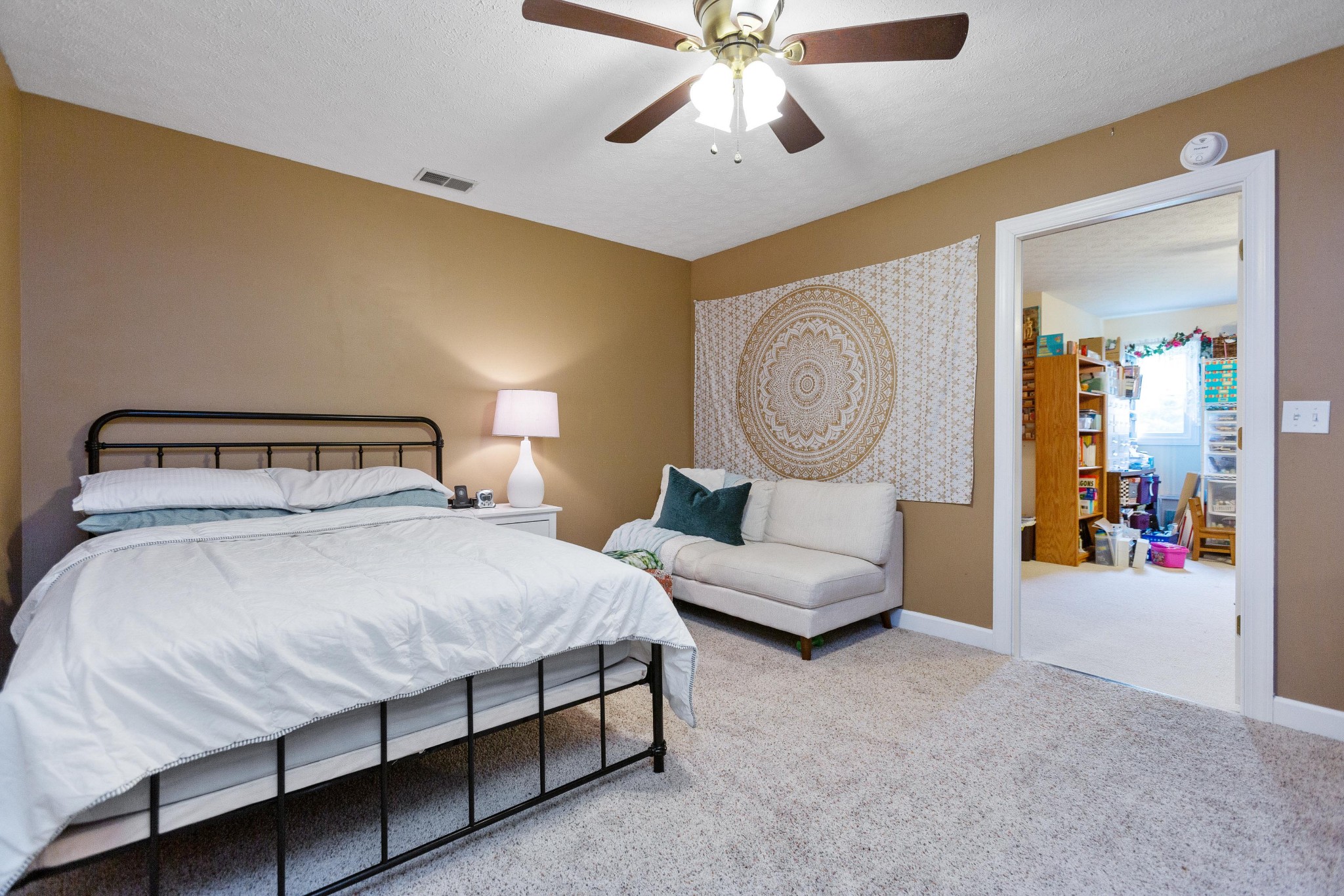 5059 Highpoint Road Pleasant View, TN 37146 - Photo 34 of 41 a bedroom with a bed and a chandelier