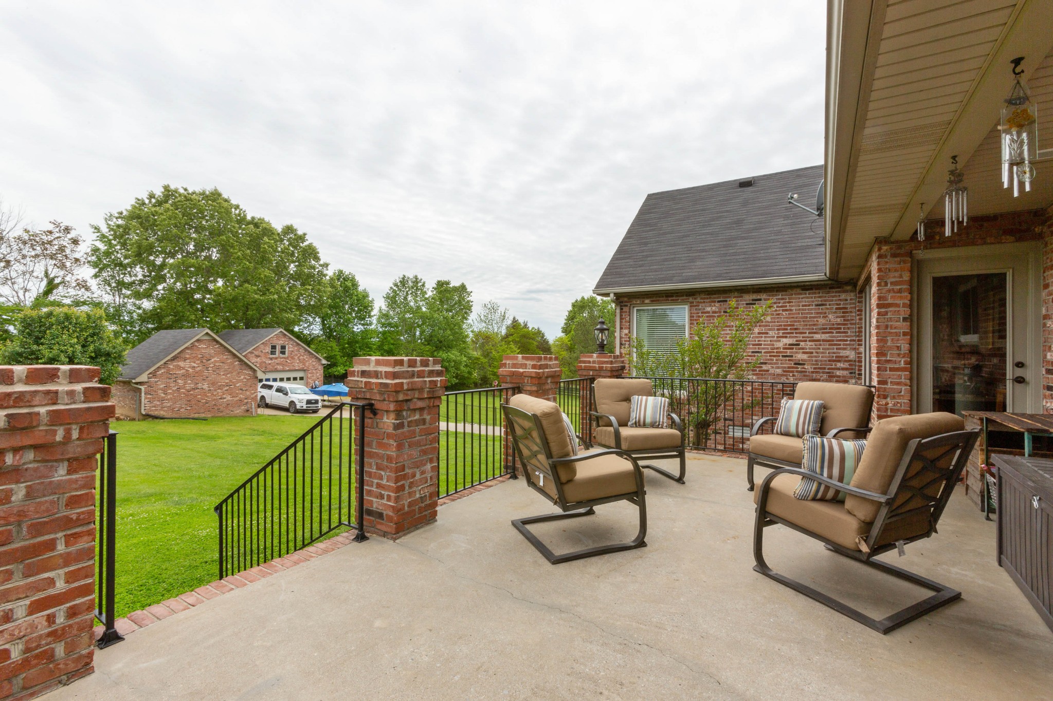 5059 Highpoint Road Pleasant View, TN 37146 - Photo 9 of 41 a view of a patio with couches chairs and a fire pit