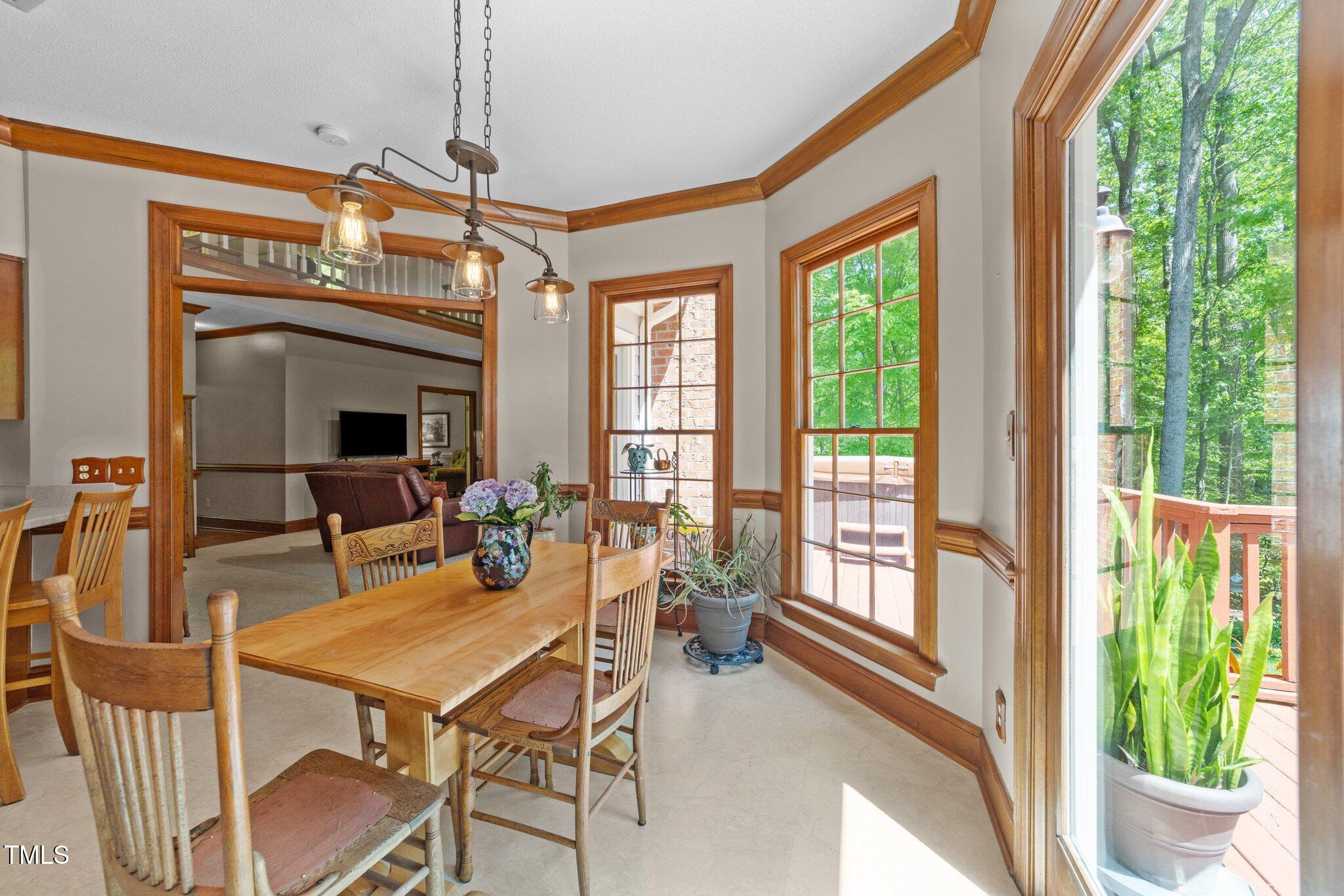 12200 Glenlivet Way Raleigh, NC 27613 - Photo 14 of 51 a view of a dining room with furniture window and outside view