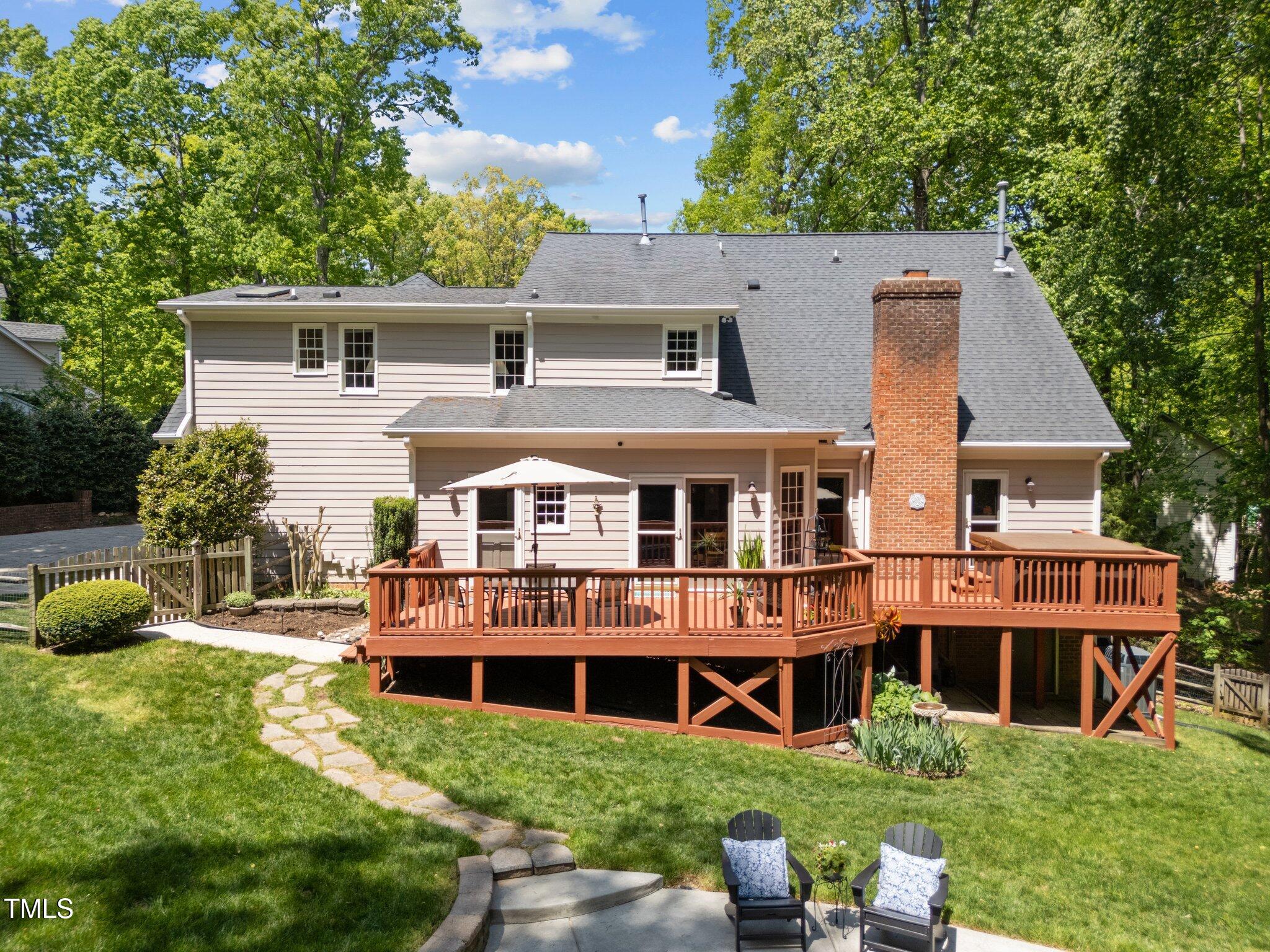 12200 Glenlivet Way Raleigh, NC 27613 - Photo 42 of 51 a view of a house with a yard and sitting area
