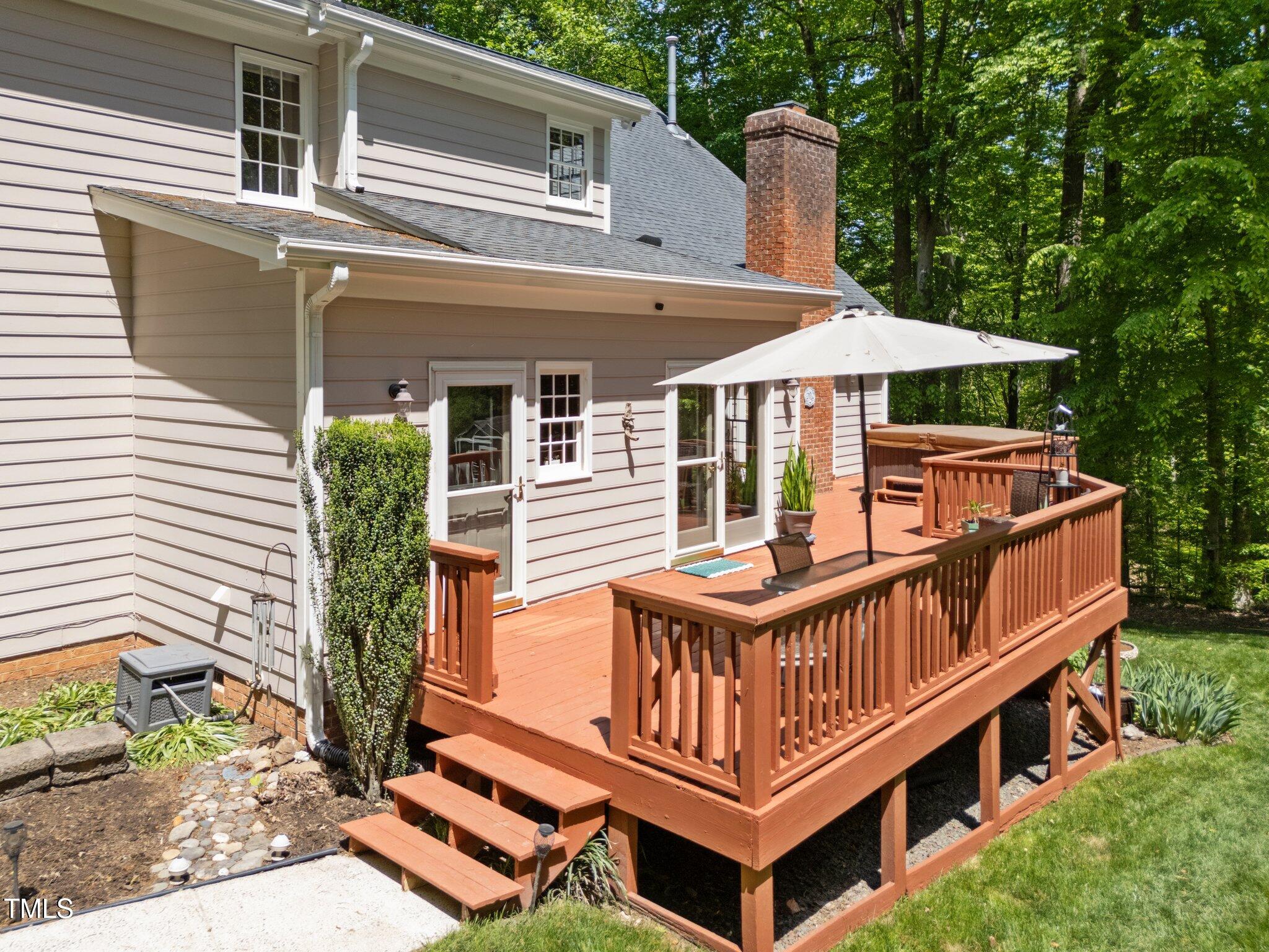 12200 Glenlivet Way Raleigh, NC 27613 - Photo 44 of 51 a view of a house with deck and yard