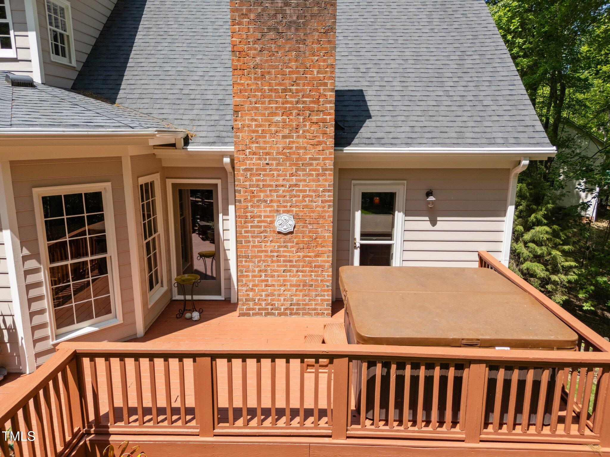 12200 Glenlivet Way Raleigh, NC 27613 - Photo 45 of 51 a view of a brick house with a large window