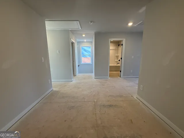 a bathroom with a bathtub double vanity sink and mirror