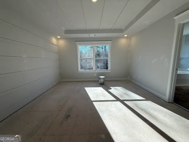 a bathroom with a double vanity sink a mirror and a bathtub