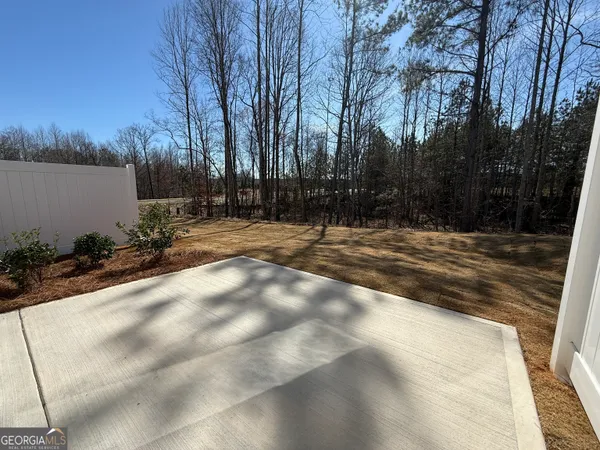 a view of backyard with green space