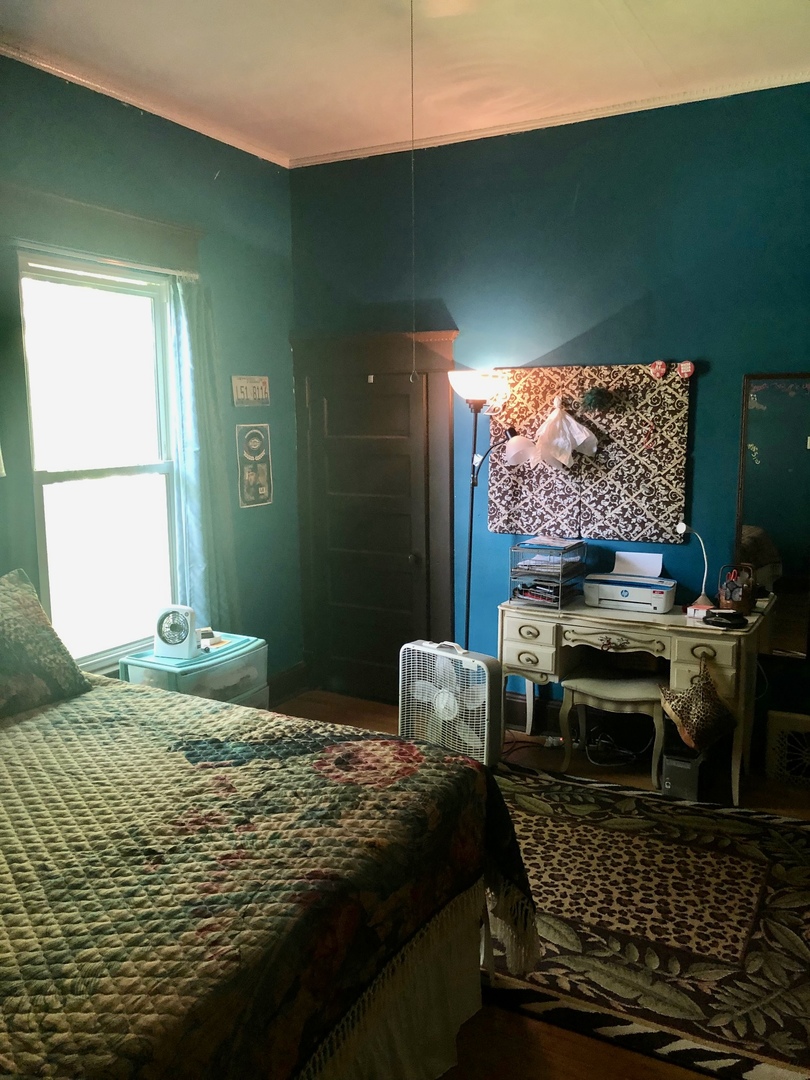 403 East 3rd Street Brocton, IL 61917 - Photo 17 of 39 a bedroom with a bed window and television