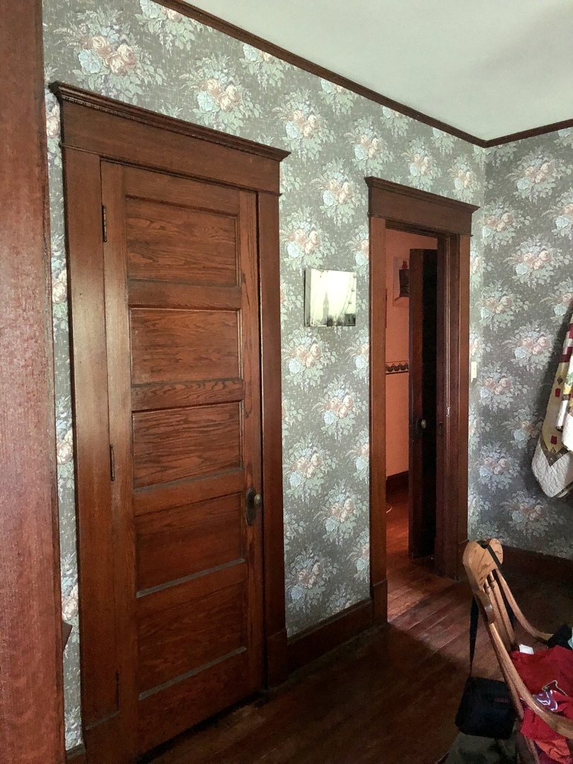 403 East 3rd Street Brocton, IL 61917 - Photo 19 of 39 a room with wooden door