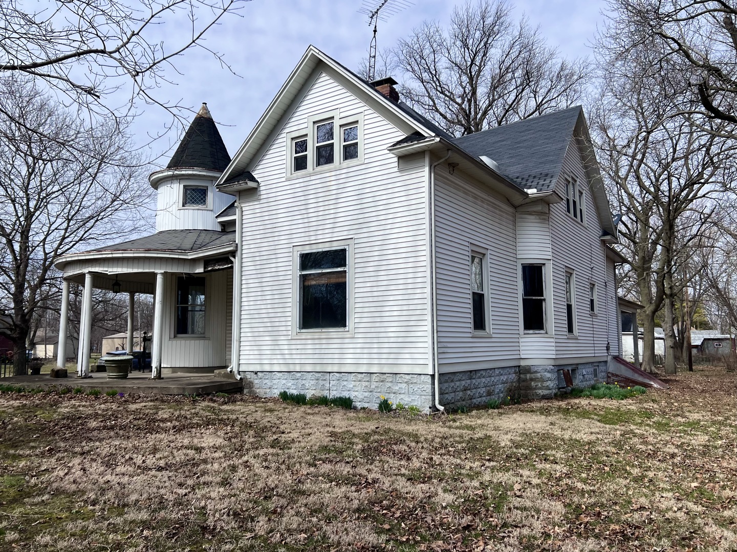 403 East 3rd Street Brocton, IL 61917 - Photo 3 of 39 a view of a white house with a yard and large tree