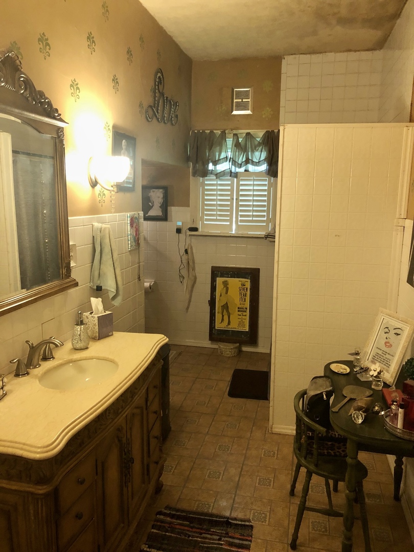 403 East 3rd Street Brocton, IL 61917 - Photo 32 of 39 a bathroom with a sink and a mirror