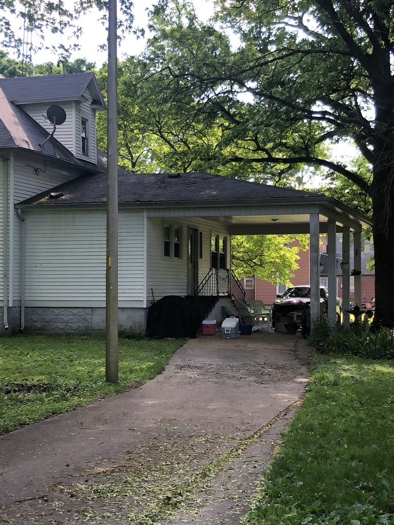 403 East 3rd Street Brocton, IL 61917 - Photo 34 of 39 a view of a chair and table in backyard of the house