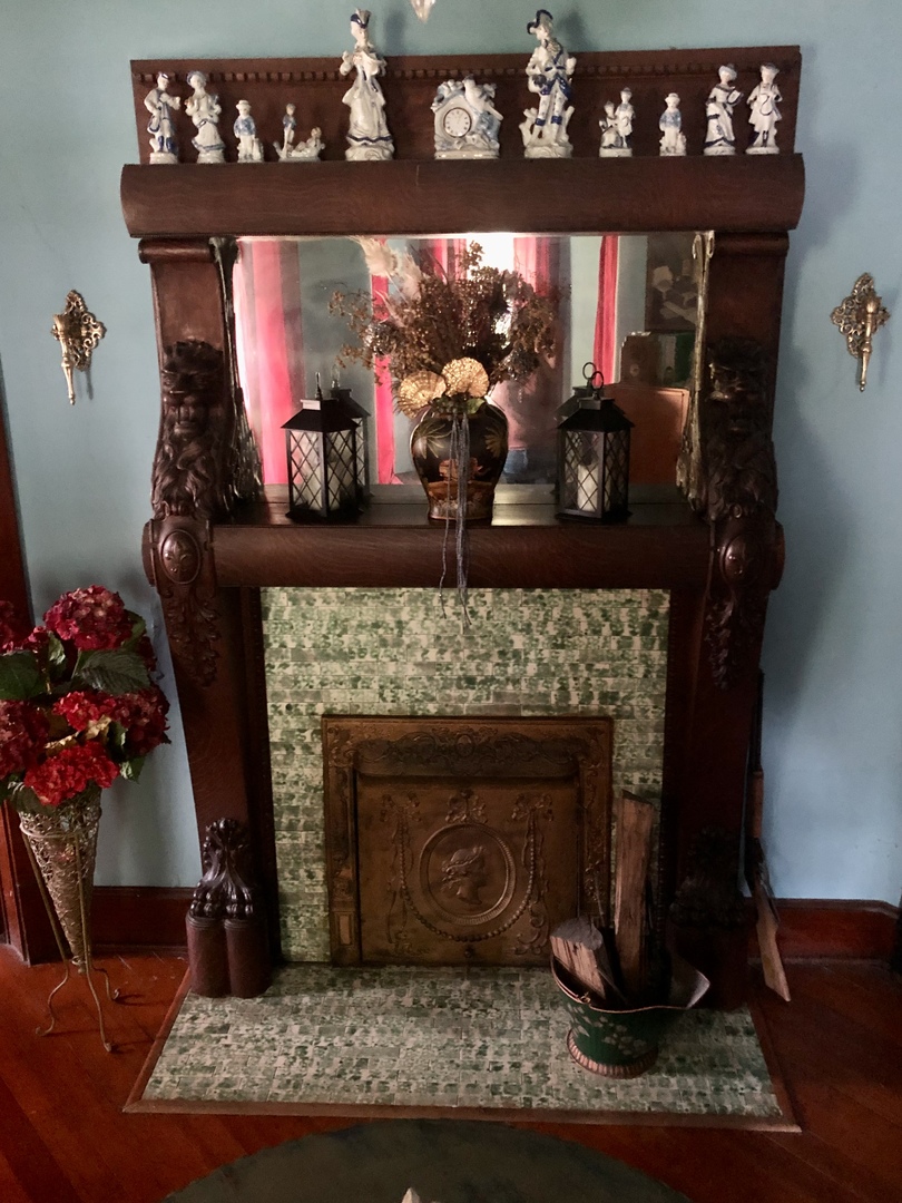 403 East 3rd Street Brocton, IL 61917 - Photo 10 of 39 a room with fireplace and wooden floor