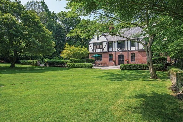 75 Sargent Road Brookline, MA 02445 - Photo 17 of 19 a front view of a house with garden