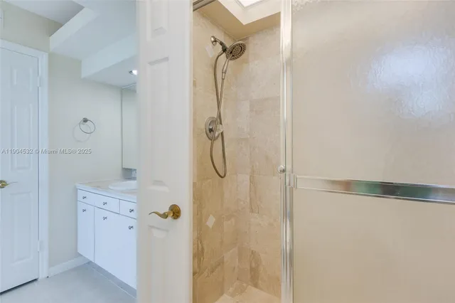 a bedroom with a bed and cabinets