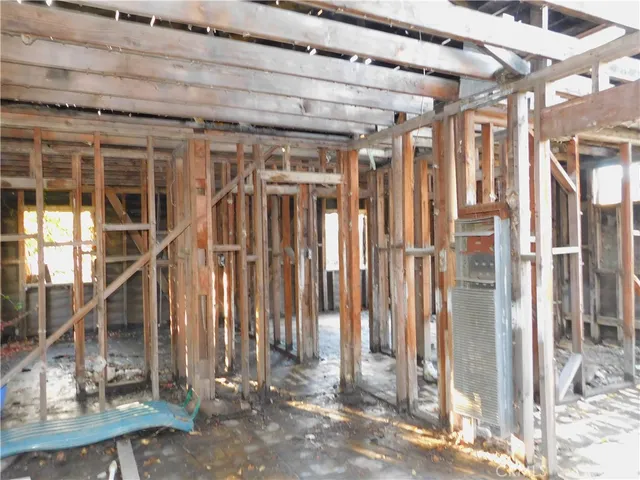 a view of a wooden door with a room