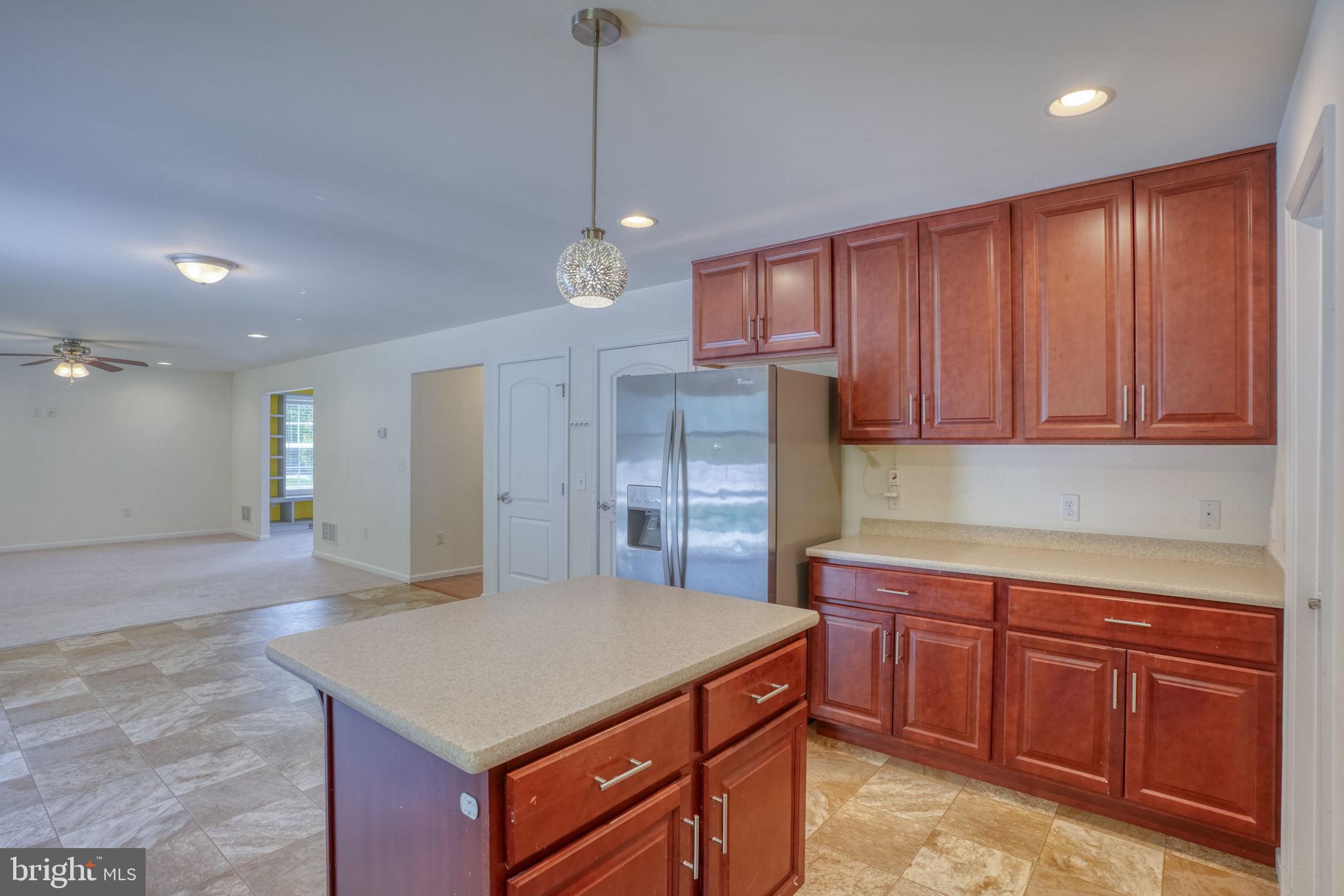 107 Hunters Run Magnolia, DE 19962 - Photo 4 of 41 a kitchen with kitchen island stainless steel appliances a sink stove and cabinets