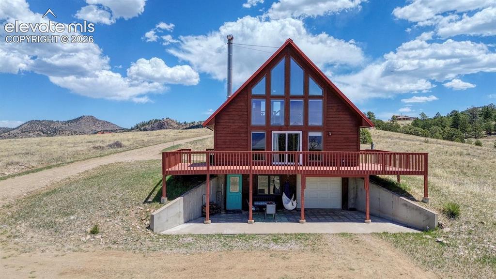 489 Excelsior Road Westcliffe, CO 81252 - Photo 31 of 34 a view of a house and a yard