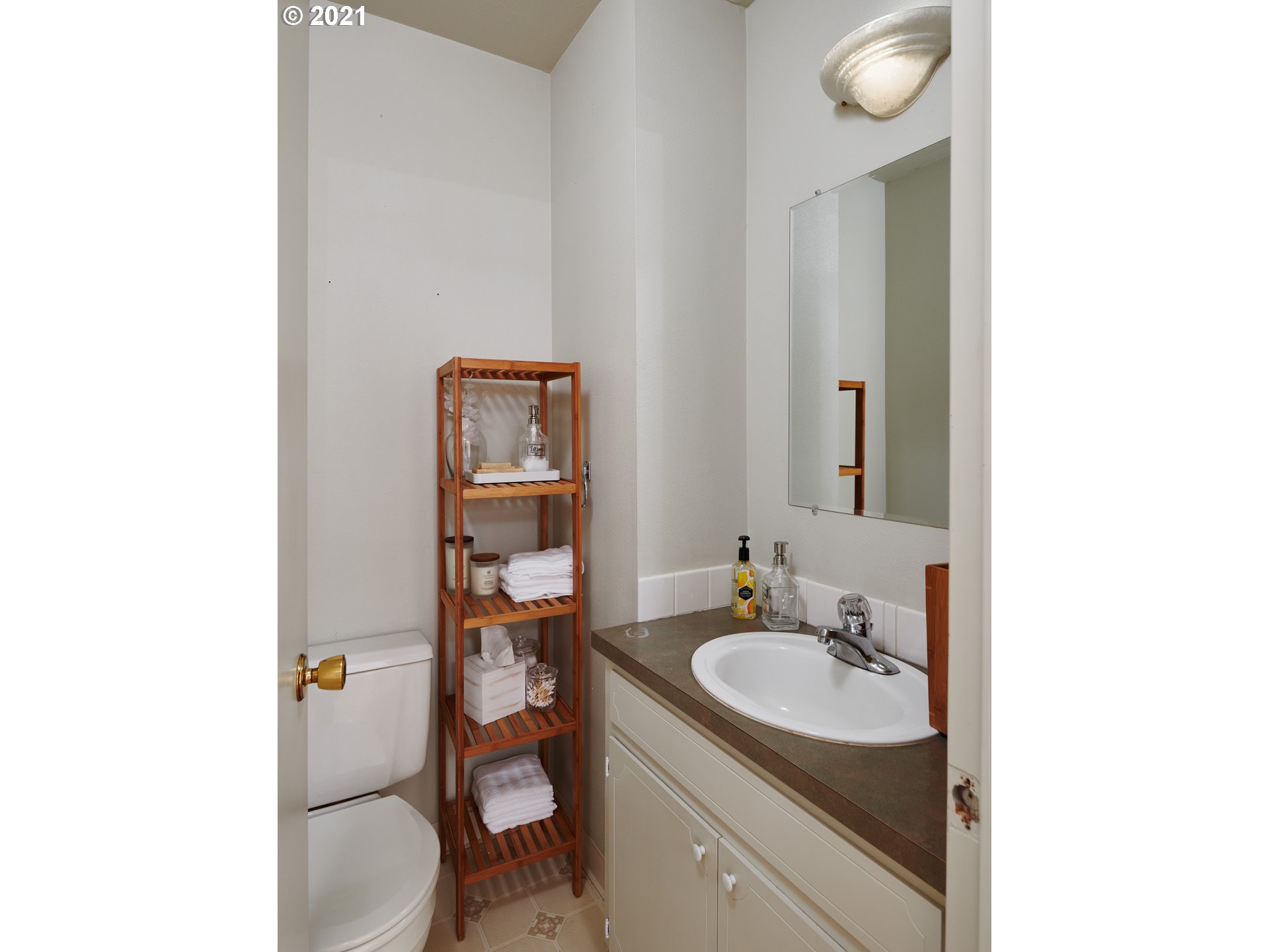 851 Southwest Broadway Drive, Unit 51 Portland, OR 97201 - Photo 9 of 19 a bathroom with a granite countertop sink toilet and mirror